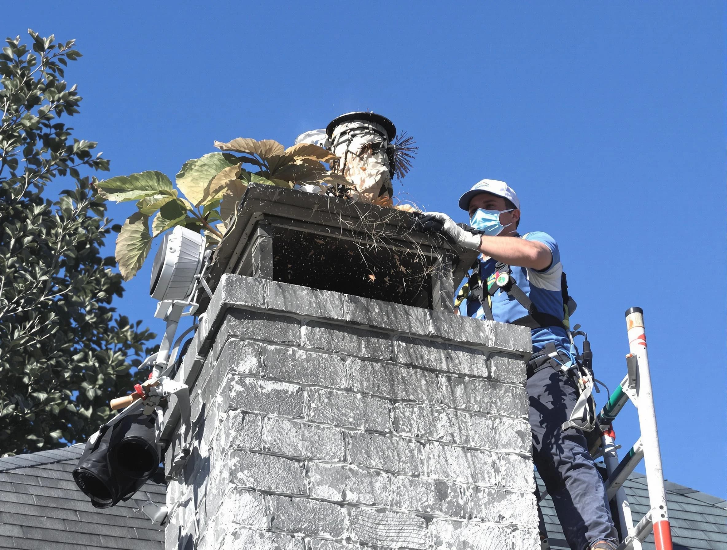 Bayonne Chimney Sweep specialist performing chimney cleaning in Bayonne, NJ